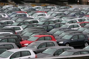 The giant parking with Volkswagen cars, golf models, ready to be delivered are blocked inside the VW Forest / Vorst by workers 23 November 2006 in Brussels. Volkswagen's Brussels workers began negotiating compensation packages today, two days after learning that 4,000 jobs were to go at their plant in the city. (Logo on the umbrella at L reads: "The car that gets us together". AFP PHOTO BELGA / ERIC LALMAND